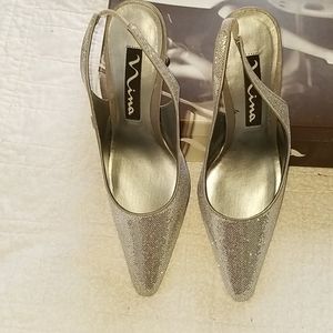 Never worn silver heels